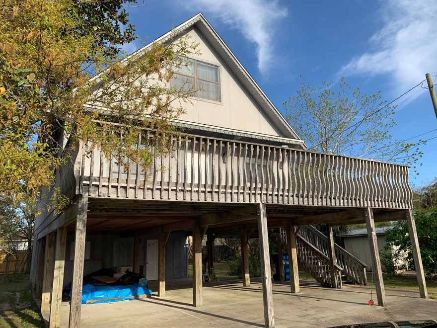 HIGHEST AND BEST BY 5PM APRIL 2.Beach house in a quiet, beach neighborhood! This great location is just 2 blocks from the gulf and Nick's Pizza! A playground is right down the street and Pier Park is about a mile away! 3 bedrooms, 2.5 bathrooms, open concept floor plan, huge second floor deck for enjoying the balmy breeze coming off the Gulf.  The first story consists of a large carport that can accommodate several vehicles and a very large utility room. The second floor has the main living area, a half bath and the master suite. Third floor consists of 2 bedrooms and a full bath. The huge, partially fenced back yard is plenty large enough to put in a pool.