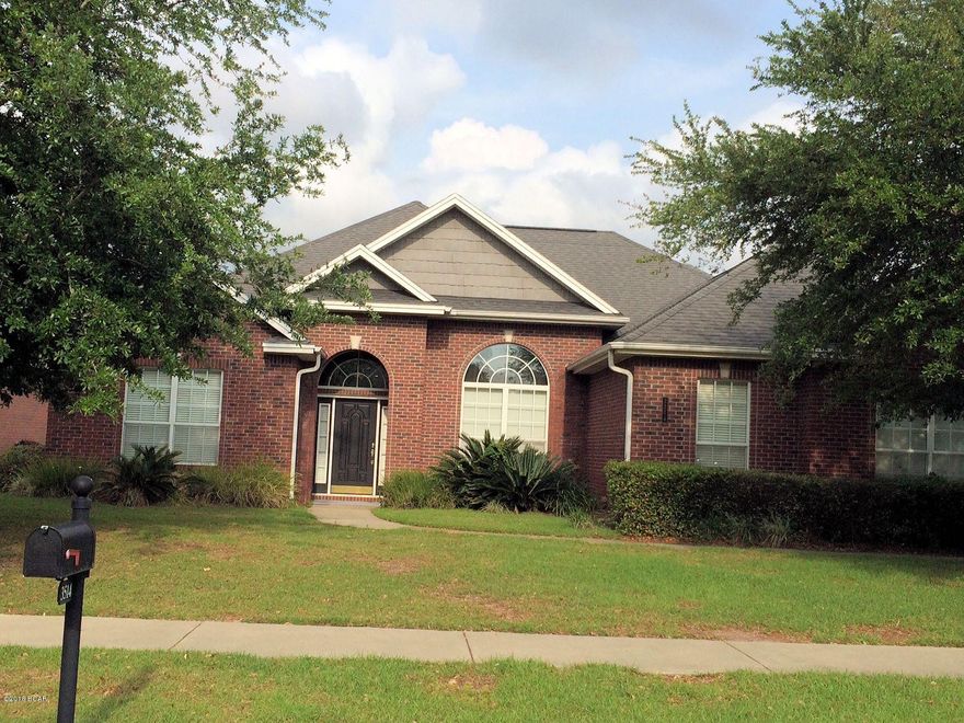 PRICE REDUCED!!!! ACT NOW AND RECEIVE CLOSING COST ASSISTANCE WITH AN ACCEPTABLE OFFER!!! Built by one of Bay County's top builders, this fabulous all brick home in The Hammocks subdivision is sure to impress you. Just 20-30 minutes from Tyndall AFB and Navy Coastal Systems. From the grand foyer entrance to the high ceilings detailed with crown molding, you see quickly this is not an average home, but rather a high end custom beauty. This home features hardwood flooring, formal dining room, home office suitable for a formal living room, and a large eat-in kitchen (top of the line GE Profile appliances, tile flooring and granite counter tops) that would make any gourmet swoon. The master bed and bath area is richly appointed and is equipped with French doors leading to an inviting pool and patio. The master bath features his and her vanity, Jacuzzi style soaker tub, and separate tiled shower plus a walk-in closet. The guest bedrooms are both spacious and share a Jack-n-Jill style bathroom, while half bath is upgraded with a mahogany vanity cabinet. This home was built to provide comfortable living as well as entertaining and exudes high quality from top to bottom. You'll enjoy years of pool side relaxation while hosting friends and family. You'll also appreciate the outbuilding/shop that could be easily converted to a pool or guest house. This is a spectacular home and is deserving of your attention, so schedule your private viewing of this one of a kind custom home.  All sizes are approximate, please measure to be sure.