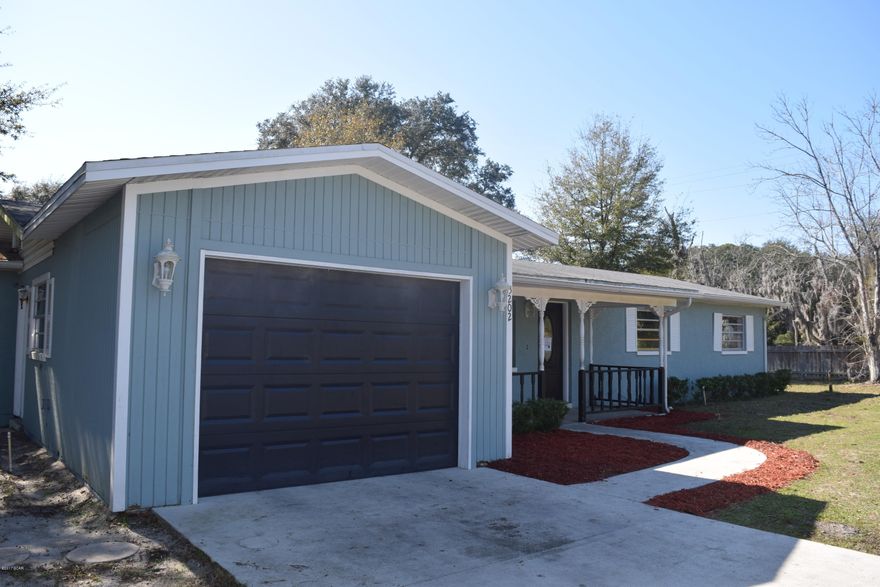 Sturdy block house on a corner lot with a great fenced in yard! The front porch is covered and has plenty of room for rockers and hammocks. The screened in back porch offers another great outdoor living space. There is a bonus room in this house that compliments the living room, kitchen and dining area, making for lots of open space for entertaining and family enjoyment. The kitchen is nice and has a breakfast bar. This home is tiled in the main areas as well as wet areas allowing for easy upkeep.