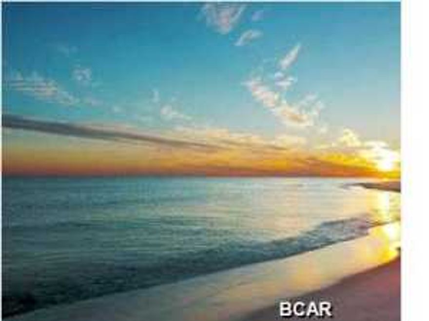 What a price for a large 2 bedroom (plus bunks)condo this close to the BEACH!! Floor to ceiling windows throughout allow the sunshine in! The living room is large allowing for plenty of room for all. Fully furnished and rental ready, the current owner will pass on his web site that produces $17k in rental income a year. The Enclave offers covered parking, pool, a sand volleyball court,tennis & basketball courts and beach access.