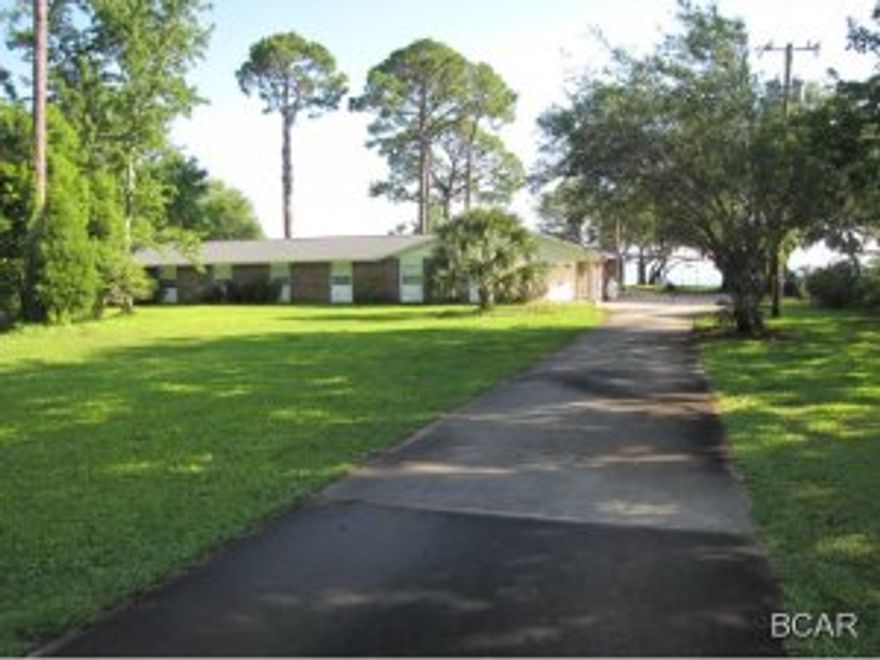 Location,Location,Location. Bay front estate size lot conveniently located in Ashland Subdivision Behind FSU Campus. The parcel has 184' on the bay that not only provides unobstructed views, but has water deep enough to accomodate most 25' to 30'boats. Convenient to the 23rd. st corridor and the beaches yet quiet and private. House is in great shape compliments of Hurricane Dennis. Other features include a game room w/bath and a three car garage that adds another 1500 sg ft under the roof.