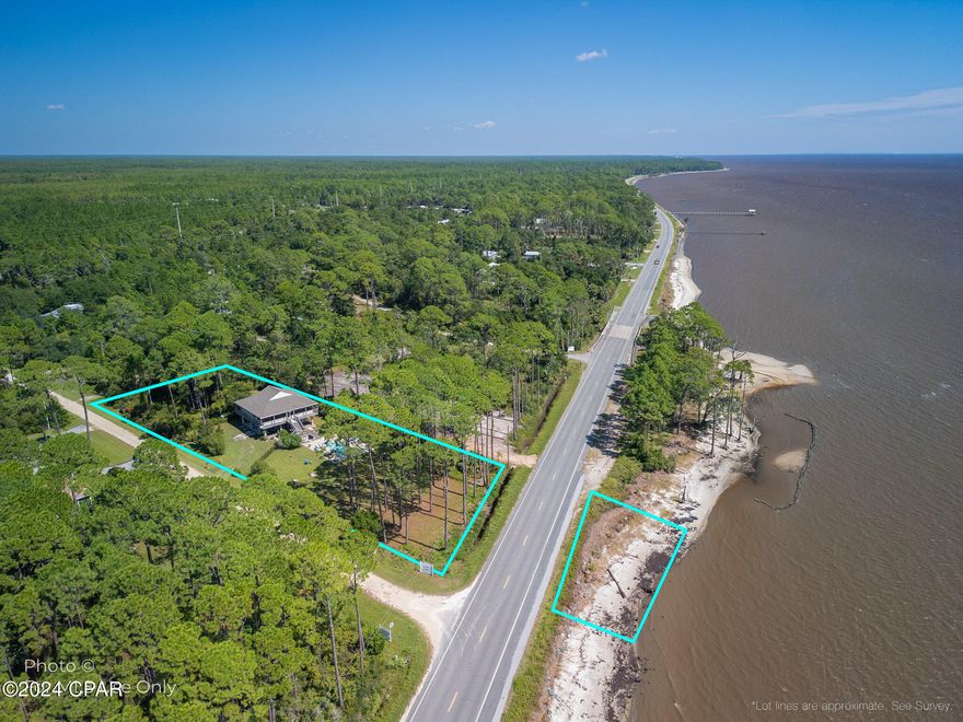 CURRENTLY UNDER CONTRACT, SELLER ACCEPTING BACKUP OFFERS! 8 Hammock Cove Road is a waterfront haven where you'll be treated to gorgeous water views both inside and outside of the home. This property includes beachfront land and the potential to add your own private dock. Perfect for embracing the coastal lifestyle you've always dreamed of. Enjoy your own private heated saltwater gunite pool which is an ideal spot for lounging or hosting friends and family. Inside, the floor plan and decor feels like a permanent getaway, with an open-concept design and split-bedroom layout. The kitchen features brand-new granite countertops, including a kitchen island that's perfect for both meal prep and casual get-togethers.  The ground floor features covered parking, workshop and storage space, RV hookup, and water softener system. Additionally, the back yard features room for RV or boat parking. For those seeking nearby adventures, the historic charm of downtown Apalachicola, with its delightful shops and restaurants, is just a short drive away. And if you're craving the pristine shores of St. George Island, its stunning beaches are also only a quick trip from home. This property also offers the rare advantage of an assumable VA loan at an incredible 2.9% interest rate. The roof was replaced in 2019. Don't miss the 3D virtual tour where you can preview the entirety of this home from anywhere. Inquire for more info!
