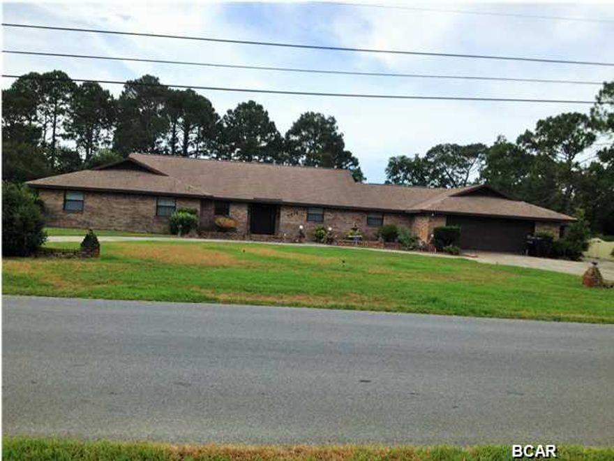 This spectacular lake front executive brick home is located on 0.58 acre in the popular Kings Point Subdivision. The home features 4 bdrm. 2 1/2 baths, 4,626 s.f with 3,422 s.f of that heating and cooled. The magnificent 24'x 40' living room is the star of this house and features cathedral ceiling with beautiful exposed beam, custom bar with sink, cozy wood burning brick fireplace and french doors leading to the outside patios. The large Kitchen has center island, tile back splash, custom solid cherry wood cabinets with tons of storage and a 10' breakfast bar. The 15 x 15 dining room offers plenty of room to enjoy family dinners and gatherings. Tons of closets and storage throughout the house. Oversize Master bedroom has his and her closets and Master bath features whirlpool tub, double vanities with separate shower and toilet. The 25'x 35' Garage has work area, sink and plenty of outlets, offers a double garage door and a single garage door on the side making this the ultimate garage. Separate 14'x 17' brick workshop outside adds to the numerous features this home already offers. This is a great home to raise a family and entertain guest! Price right so hurry will not be available for long.