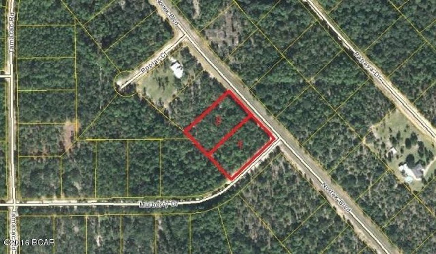 NOT YOUR TYPICAL Compass Lake in the Hills lot. If you are interested in a BEAUTIFUL LOT for Building Your Home then THIS ONE IS IT !! This 2+ Acre Estate Quality Double Lot is on the SouthWest corner of paved Nortek Blvd and Mulberry Dr in the desirable Eastern Portion of the Compass Lake in the Hills development in NorthWest Florida. This area of the development is populated by many Custom Built Homes and is preferred by most because of its Clean Look and Quiet Environment. Conveniently located just 15 minutes South of Interstate 10 and about 40 minutes North of Panama City for Shopping, Restaurants, Entertainment, and Beautiful Gulf Beaches. This gorgeous property is Level and Dry, underbrush has been cleared and the abundant trees have been left for the Buyer to clear as desired. As an Owner in this development you have access to Private McCormick Lake for Swimming, Fishing, Canoeing, Kayaking, etc, as well as the Main Lodge over on Compass Lake with Swimming Pool, Tennis Courts, Horseback Riding, etc. Come enjoy the Quiet Peaceful Lifestyle of Compass Lake in the Hills.