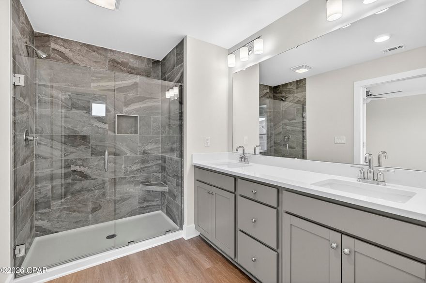 NO RENTAL RESTRICTIONS!!! Our stunning pool is NOW OPEN! The prefect place to SOAK UP THAT Florida SUN! Seagate at Clara is a new townhome community nestled in the vibrant city of Panama City Beach, FL. This two-story unit features board and batten exterior and covered entries. One car garage provides a great space for storing beach essentials. This open concept townhome boasts a stylish kitchen with white cabinets, tile backsplash, a large island with quartz counter tops - perfect for entertaining.  The elegant Owners Suite is designed with comfort in mind showcasing a large walk in closet and double- bowl vanities. Main Bath has tiled shower.  All bathrooms have quartz countertops.  LVP is located throughout the home.  The community pool features a cabana, lounging, seating and grilling stations. This community has a dedicated dog park. Seagate at Clara is in a prime location, approximately 1.4 miles to the sandy beaches and just minutes from Pier Park.