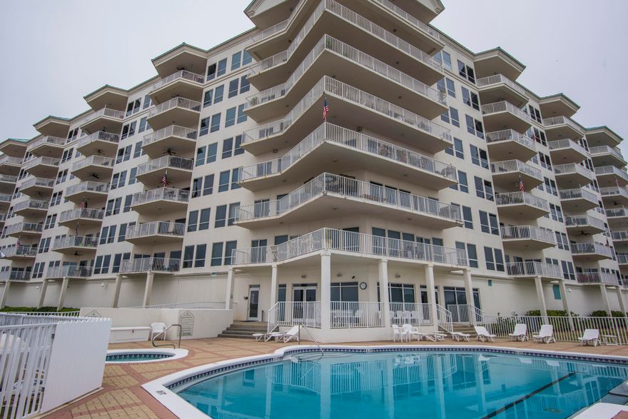 LOWEST PRICED CONDO IN BUILDING!This amazing 3rd floor unit has beautiful views of North Bay.Bring your boat! Enjoy the stunning sunsets while entertaining or relaxing in this spacious 2 bed/2 bath home. As you walk in you will immediately notice the large windows and sliding glass door along the back wall,hard wood floors,immaculate upkeep,and spacious floor plan.Additionally,the home offers a large balcony with access through living room and master bedroom.Both bedrooms are large and have generous closet space.Unit conveys with one reserved parking space located in the covered garage.Extra parking for guests provided in parking lot.The relaxing nature of this complex is perfect for a vacation home or permanent residence. Minutes to beach, lake, and entertainment.