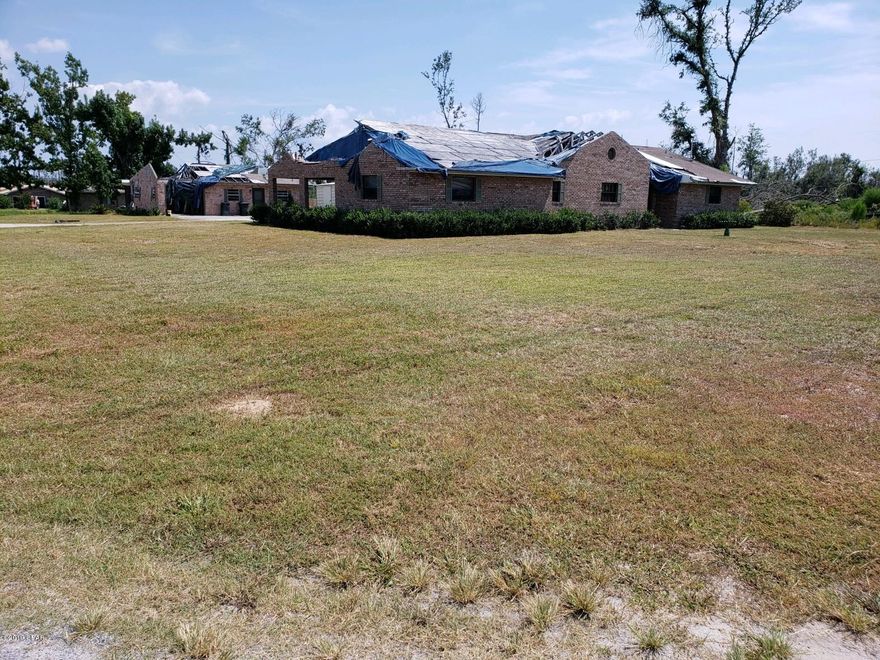 * DANGER! * PLEASE DO NOT APPROACH OR ENTER THE STRUCTURES* Large building lot, 129x203, in established neighborhood. Home was destroyed by Hurricane Michael and is on the list to be demolished and removed if not sold first.  The property has two septic systems, well, sprinkler system, and an underground salt water tank from a water conditioning system.  No survey available, seller has original house plans if interested in rebuilding.  Metal shed does not convey.