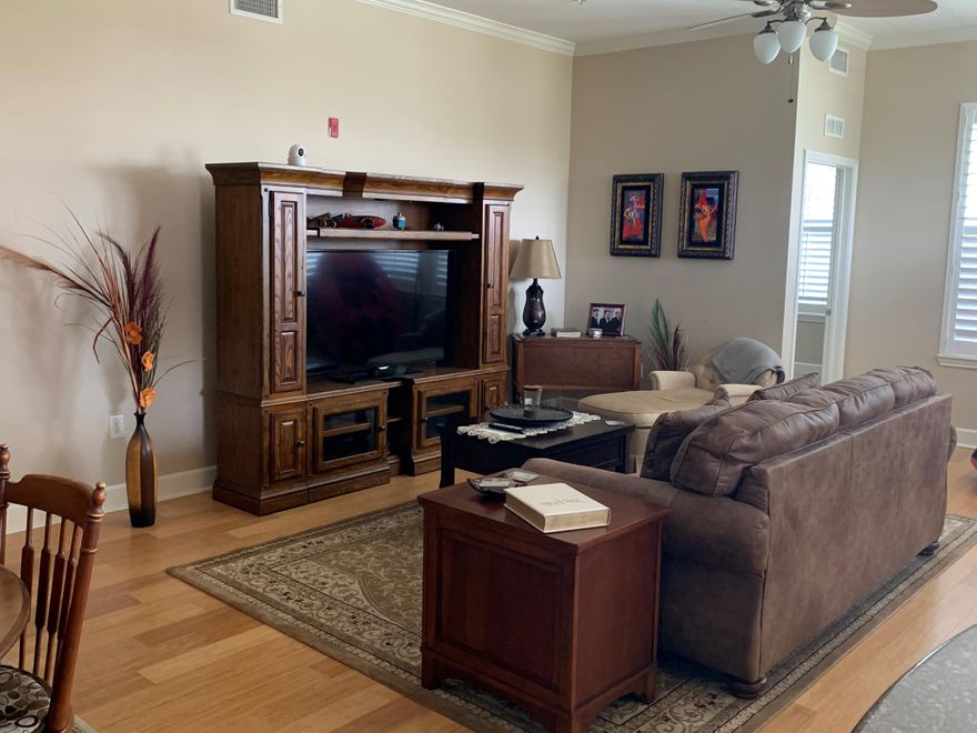 Island Reserve = Resort Living. One of the few condos not allowing short-term rentals. This updated, inward end unit overlooking the pool is move-in ready. New bamboo flooring in living/dining and master WIC, new carpet in all three BRs, tile in the other areas. Granite counter tops in kitchen and bathrooms with soft-close cabinet doors. New range with induction cooktop and convection oven, and new washer & dryer. Wood shelving in master WIC. Manicured grounds have fountains, palms, hot tub, and a pool with waterfalls and lap lanes. Community building has weight room, basketball courts, movie theater, meeting/party room, and onsite management office. Truly a hidden gem.