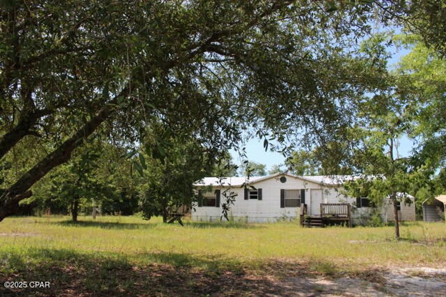 Are you ready for the move! 10.14 acres of peaceful country living! This 3-bedroom, 2-bath mobile home is a rehab project with great potential—perfect as your primary residence, a hunting camp, or a guest home for family and friends while you build your dream home on the rest of the property. Situated on a quiet dead-end road with deeded access, most of the land is high, dry, and wooded—ideal for privacy and outdoor enjoyment. Nestled in a serene, wooded setting, this lot provides an ideal spot to escape the hustle and bustle. Just a short 30-minute drive (MOL) to Dothan, AL, you'll have easy access to shopping, dining, hospitals, and entertainment.  Less than 20 minutes and you are launching your boat into the Chattahoochee River.  Plenty of room to create your own mini farm or simply relax and enjoy the seclusion of rural life.
