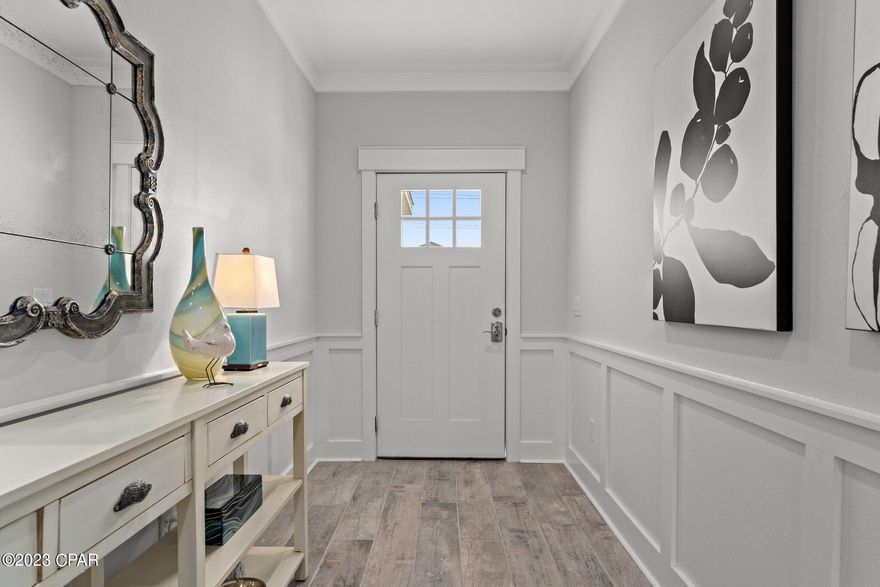 Welcome to Laguna Haven. This new secluded gated community located at the West End of Panama City Beach, north of US-98. This Florence floor plan features 4 bedrooms, 2 full baths and 2 car garage. Step inside the home to find wood-look porcelain tile, soaring ceilings, crown molding, bull-nose corners give those extra touches of elegance, and a designer lighting package. Your kitchen features Samsung (fingerprint-proof) stainless steel appliances, a walk-in pantry, soft-close Shaker cabinets, an under-mount sink, Calacatta Bravos quartz countertops, and Satory mosaic backsplash. Just steps away, you can enjoy the fully landscaped backyard featuring a built-in sprinkler system with a separate irrigation meter. Back inside, the bathrooms include all of the same high-end finishes found throughout the rest of the home, including shaker-style vanities, designer fixtures and porcelain tiles. The master bedroom boasts tray ceilings & recessed LED lights, while the ensuite has double sinks and a custom-tiled walk-in shower with a glass door. Don't forget about all the storage in the laundry room and attached garage! This home comes with a 1-year builder warranty, and the HOA includes exterior & common area landscaping and trash pick-up, as well as community lights, fountain & gate maintenance. Public water and sewer. Laguna Haven is close to schools and all the shopping, dining & entertainment options along the Panama City Beach Pkwy and 30A. Another BONUS for you in this community that's LESS THAN ONE MILE from the beach: Short-term rentals are allowed!