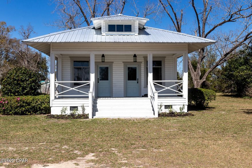 Super cute, updated southern cottage with original heart-pine siding and floors. 11 foot ceilings throughout with tongue and groove wood ceilings in dining room and bathroom. Fireplace in living room and master bedroom. Beautiful tiled floor and shower with double sided glass surround in bathroom. Tile floors in galley kitchen with all new custom wood cabinets, granite counter tops and stainless steel appliances, including gas range. Tankless gas hot water heater and new 3 ton HVAC system. New metal roof and all new paint inside house and out. 200 amp service with all updated wiring throughout. Termite bond. All new ceiling fans and light fixtures throughout. Located 30 minutes south of Dothan, AL and 19 minutes north of Marianna.