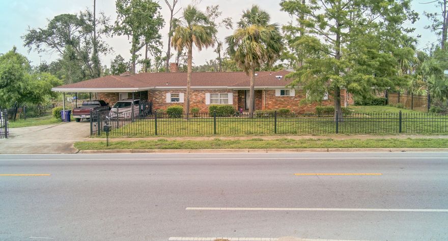 Unique 3 bedroom/3 full bath home nestled near the historic St. Andrews area. This charming, all brick home sits on a large, spacious lot with views of Lake Caroline. Interior offers an abundant amount of living space! The open kitchen with exposed brick wall, overlooks the dining area perfect for mealtime prep & dinner chats. Office space is provided just off the kitchen, with the den offering additional sleep space for guests with built-in Murphy style bed. Exposed brick wall is a continued feature as you enter the Family Room just off the dining area. This amazing space is perfect for entertaining with wet bar (currently not plumbed), decorative liquor cabinet, complete with stone wood-burning fireplace & floor-to-ceiling views of the lake. Enjoy afternoons on the expansive back deck. Backyard also features an all-brick, 11x19 workshop with brand new roof (Patio glass doors did receive damage; only one-side is currently operational). Make an appointment today to preview this well-loved home today! All sizes/info/measurements are approximate; please verify if important!