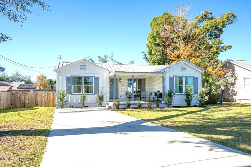 CURRENTLY UNDER CONTRACT, SELLER WILL CONSIDER BACKUP OFFERS. This historic home blends classic charm and contemporary comfort. A quick golf cart ride to PC downtown, the Yacht Club, and waterside views makes it an ideal location. The hardwood floors give warmth throughout, and the updates give a new spin on the homes character. Buyers can have peace of mind knowing the electrical, plumbing, A/C, and windows were recently renovated, and the block construction and metal roof add to the quality of the structure.  The kitchen is beautiful with quality finishes and a large island ideal for food prep and casual meals. The open dining area provides a perfect space for gatherings. This is a split floor plan, and the primary suite includes an en suite with a double vanity and tile shower. The additional bedrooms are comfortable in size and both bathrooms have been updated. Sizeable lots are hard to find these days, but this large, fenced yard is perfect for privacy and outdoor activities.  The Cove is a historic neighborhood that is valued by locals and appreciated by those lucky enough to experience the stories it has to share. This property has an effective year of 2021 and is a must-see for those who appreciate both the past and present!