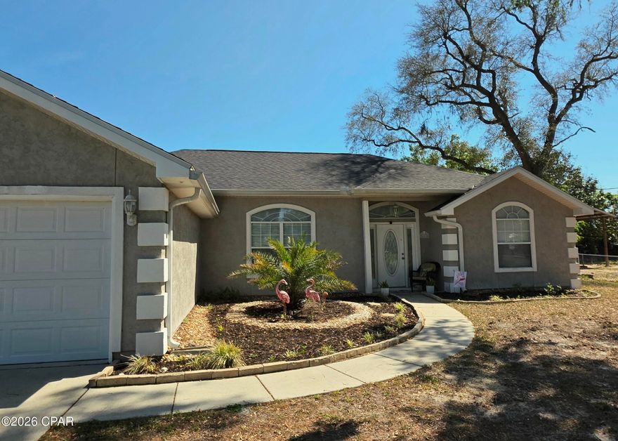 Absolutely beautiful move in ready home located on a large lot in a quiet neighborhood.  No HOA.  The spacious great room features 10 ft ceilings and a gas fireplace.  Extra large ceiling fan for added comfort.  Vinyl plank flooring is in the main living areas with carpet in the bedrooms.  The kitchen is showcased with beautiful granite counters, upgraded cabinets, and stainless steel appliances. The master bedroom features a tray ceiling along with a vaulted ceiling in the large master ensuite bathroom.  His and her walk-in closets.   Plus the additional bedrooms feature walk-in closets.  Large linen closet. Interior laundry room.  Privacy fenced backyard has two gates.  Large covered patio and slab.  8x10 storage shed with ramp for easy access.  Mature oak trees with moss in the front yard.  Prior owners did a complete overhaul of the home after Hurricane Michael.  It was taken down to the studs making it like a brand new home with new roof, flooring, cabinets, lighting and fixtures, appliances and new paint and trim.  Conveniently located near Tyndall AFB, shopping, restaurants and the World's most beautiful beaches.  (All important details should be verified by the appropriate specialist.)