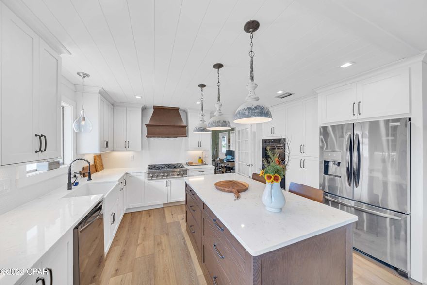 CURRENTLY UNDER CONTRACT, SELLER ACCEPTING BACKUP OFFERS Open the door and say WOW! This Panama City Beach home has been remodeled from top to bottom. All new kitchen, baths, floors, cabinets, shiplap, appliances, HVACs, metal roof and more!  The seller has spared no expense adding a fabulous outdoor kitchen, paver patio and heated pool. The backyard is dreamy with gorgeous trees and lovely outdoor spaces.  3 bedrooms, 3 full baths, office, Florida room, oversized garage and a great bonus room that can be a 4th bedroom, 2nd office, hobby room, or whatever suits your needs.  Situated on a sprawling lot, just off the cul de sac circle, on one of best streets in Bay Point.  Bay Point is a gated community with security, tennis, golf, walking paths and a new marina under construction!