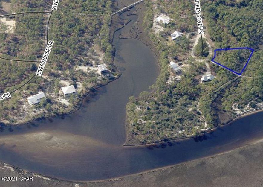 Nearly 3/4 of an acre at the end of the cul-de-sac in the sought after gated community of RiverCamps. This Lot backs to Crooked Creek with no neighbors behind-ever! Access the 7 miles of trails that run next to this beautiful wooded Lot. RiverCamps is a gated, waterfront community consisting of 1500 acres surrounded by Crooked Creek, West Bay and the Intracoastal waterway. Owners enjoy world class amenities including a community boat ramp, dry boat storage, day-use boat slips, zero-entry heated pool, fitness center and use of kayaks, canoes, bikes and paddle boards. Of the 1500 acres 1000 are reserved for conservation with the remaining 500 acres for less than 450 homes.

All of this and you are 5 minutes from the airport and 15 minutes from the world famous white sand beaches of PCB!