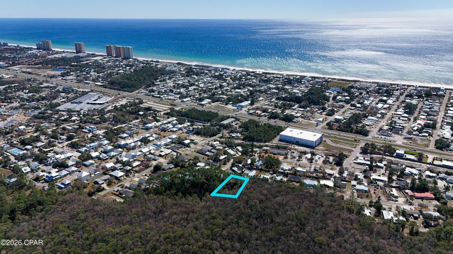 Less than one mile from the pristine white sandy beaches of Panama City Beach, this vacant land offers an exceptional opportunity for builders, developers, or investors seeking a coastal location with strong upside. This approximately 1.86± acre parcel provides ample space for a small multi-family, townhome, or residential development in an area experiencing continued growth and demand.

The property features paved road access with public water and sewer available at the street and is zoned R-2, allowing for single family & multi-family.

Need more land? Additional adjoining Malaga parcels are available, allowing for a combined assemblage of approximately 3.7± acres for a larger development footprint or long-term investment strategy.

The property's proximity to Panama City Beach's sandy shores, less than one mile away, ensures that residents will enjoy the ultimate beach lifestyle, with sun, surf, and relaxation just a short stroll from their doorstep.

Panama City Beach consistently ranks as one of Florida's top tourist destinations, offering investors the potential for significant rental income and long-term appreciation.