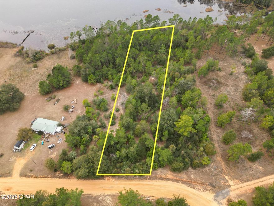 Tucked away on McPherson Drive in the desirable Highlands of Compass Lake, this 0.86-acre waterfront lot offers a beautiful setting to bring your vision to life. With water frontage and a peaceful, natural backdrop, the property provides a serene environment that's perfect for a future homesite, weekend retreat, or long-term investment.

Enjoy the feel of privacy and space while still being conveniently located near Highway 231, allowing for an easy drive to surrounding towns and Panama City. Whether you're looking to build now or secure land for the future, this spacious waterfront parcel presents a wonderful opportunity in a well-established North Florida community.