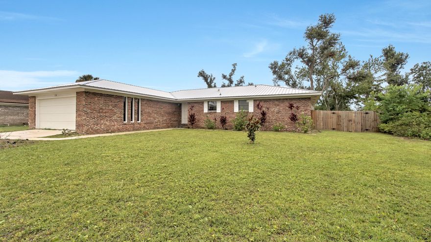 Incredibly well maintained brick home on a quiet family friendly street. This 3 bedroom, 2 bath charmer boats plenty of natural light and the pride of ownership. Featuring a new metal roof, tiled showers, new flooring, attached garage, modern/updated kitchen this home is sure to impress. Conveniently located to Tyndall Air Force Base and Tyndall Parkway featuring many shopping and dining options.