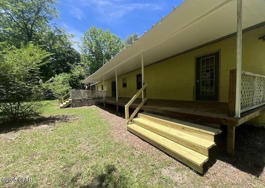 AUCTION. Price Improvement! Nestled in a quiet and peaceful area, this cute bungalow-style home offers the perfect blend of country living with city conveniences just minutes away. Set on over one acre of land, this property is full of potential for buyers looking to customize a home and create their dream retreat.

Features include a spacious covered porch perfect for relaxing and enjoying the serene surroundings, and a durable metal roof for added value and longevity.

Whether you're looking for a tranquil place to call home or a smart investment opportunity, this property has the bones and location to shine. Don't miss your chance to own a slice of quiet Florida countryside with all the perks of nearby amenities.

All information recorded in the MLS is intended to be accurate but cannot be guaranteed, buyer advised to verify.