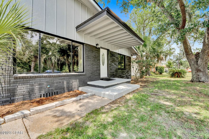 CURRENTLY UNDER CONTRACT, SELLER WILL CONSIDER BACKUP OFFERS Welcome to 3724 Shoreline Circle, an attractive and fully renovated residence nestled in a peaceful neighborhood in the heart of Panama City, Florida. This immaculate home combines modern elegance with comfortable living, offering a luxurious retreat for its fortunate new owners. With its thoughtful design, superior craftsmanship, and premium finishes, this property is sure to impress even the most discerning buyer. Step inside, and you'll immediately notice the attention to detail and the abundance of natural light throughout the open-concept floor plan. The home boasts a spacious living area, perfect for entertaining guests or spending quality time with family. The kitchen features stainless-steel appliances, sleek granite countertops, and ample custom cabinetry. The cabinets are ''Starboard'' and cannot be destroyed by water and food. Adjacent to the kitchen is an elegant dining area, where you can enjoy delicious meals while taking in views of the backyard. The home offers three generously sized bedrooms, including a beautiful master suite. The master retreat provides a peaceful haven with a private ensuite bathroom that features a double vanity, and a large walk-in shower. The master also features a huge walk-in closet! The additional bedrooms are all well-appointed, with plenty of closet space and easy access to the beautifully renovated bathroom. Step outside onto the expansive patio and discover your private oasis. The large backyard offers endless possibilities for outdoor entertainment and relaxation. Whether you envision hosting barbecues, gardening, or simply enjoying the Florida sunshine, this space is truly a homeowner's dream. The entire property has been tastefully updated with modern fixtures, designer finishes, and premium flooring, ensuring a turnkey experience for its new owners. The home is ideally located, providing easy access to nearby amenities, shopping centers, dining options, parks, and premier schools. With its blend of style, comfort, and functionality, this extraordinary home offers the perfect balance for modern living. Just a short stroll from the boat ramp, this is the perfect home for the avid boater. Don't miss the opportunity to own this exceptional property. Schedule your showing today! All measurements are appox, and should be verified by buyer if important.