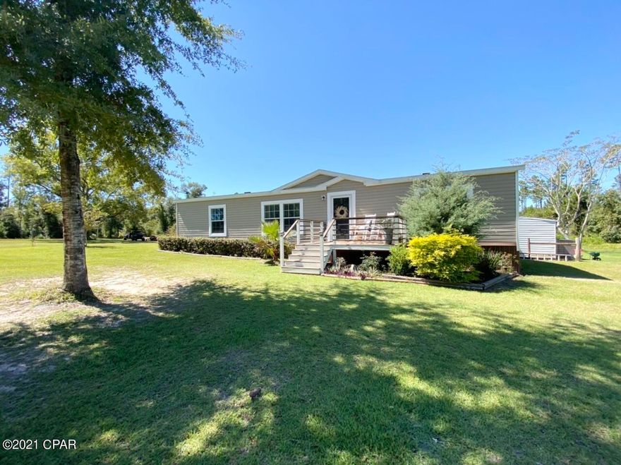 This is a beautiful, meticulously maintained home in the country! Home is on paved road. This 2017 model 3 bedroom 2 bath home boast a very functional open floor plan, amazing garden style tub and walk in shower in master bath, nice size pantry with barn style door, new stainless steel refrigerator,  front and back decks for relaxing and entertaining and the list goes on. This is truly a must see and will not disappoint nor last long! Call for your showing today.