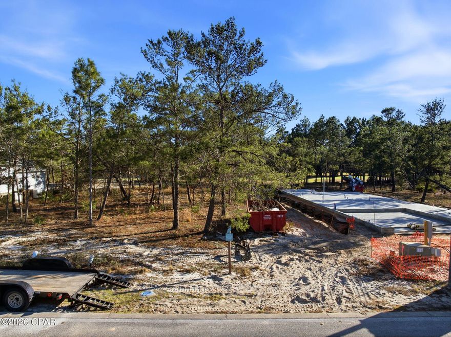 Build your dream home in the gated coastal community of Wild Heron. This homesite at 1540 Salamander Trail offers a beautiful opportunity to create a custom retreat surrounded by nature, privacy, and timeless architecture. House plans are included, saving you time and allowing you to move confidently toward your vision. Wild Heron is known for its serene setting along Lake Powell, championship golf at Sharks Tooth, and amenities that embrace the coastal lifestyle including community pool, fitness center, dock, walking trails, and more. Whether you're building a full-time residence or a second home escape, this lot offers the perfect foundation in one of the area's most sought-after neighborhoods. Let's bring your vision to life in Wild Heron.