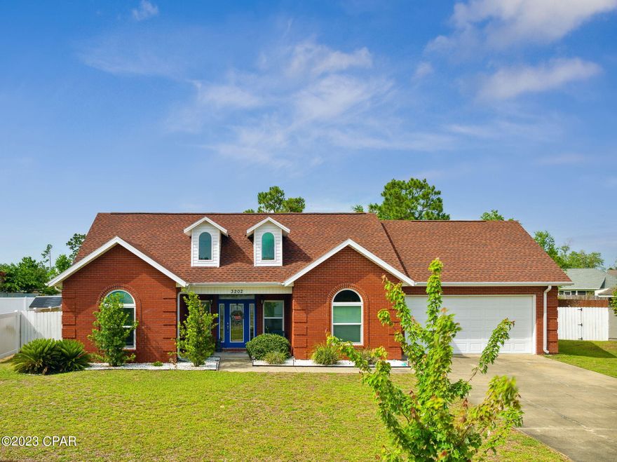 CURRENTLY UNDER CONTRACT, SELLER WILL CONSIDER BACKUP OFFERS This charming, custom brick, 4-bedroom, 4-bathroom home is in the family-friendly pool community of The Hammocks. This home features a split floor plan with cathedral ceilings throughout the main living space and tray ceilings in the bedrooms. The spacious living room has a corner gas-burning fireplace that is perfect to cozy up next to. The 4th bedroom is located upstairs, along with a half bath making it the ideal guest suite, playroom, or theatre. As you step out the back door and onto the large patio, you can imagine the Barbecues that could be hosted at this home. This is the perfect yard with plenty of green space for the kids to play and a large fence for privacy. The yard has a sprinkler system to maintain the beautiful outdoor space. This home has plenty of storage with a pantry in the laundry room and a walk-in storage room in the oversized garage. Features of this desirable neighborhood include a community pool, green space, and mature trees.