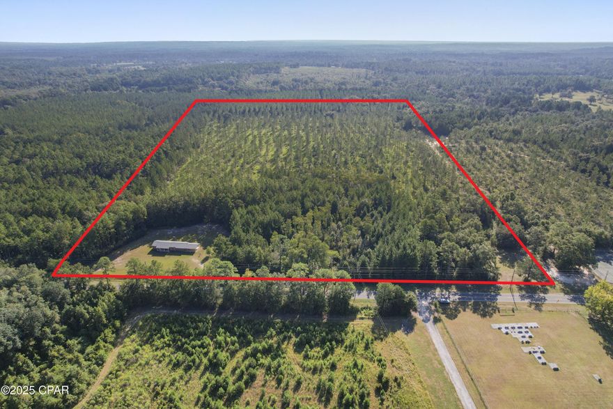 Looking for a hunting or fishing lodge?  Investment rental property?  You have found it!!  No restrictions on parking a camper/boat or multiple vehicles here.  This 36 acre parcel is cleared around the home and is a wooded haven behind the home.  A cleared field is ready for a camping or hunting.  This 3 bedroom/2 bath needs some TLC but would make a great rental or getaway.  Original hard wood floors, tongue and groove paneling, AC is in working order, oversized laundry room make a quaint space for many options.  Located near Holmes Creek and several public boat launches, 40 minutes to Lynn Haven, 15 min to I10, 45 minutes to Panama City Beach.
