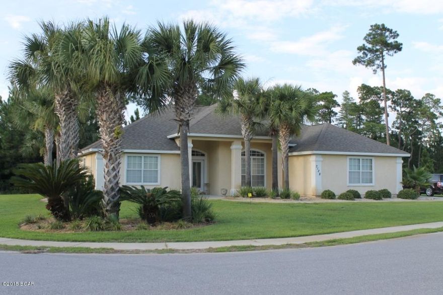 This is a great 4 bedroom 2.5 bath home in the gated community of Dolphin Bay located on the East end of Panama City Beach, and just a short drive to the Navy base and beach.  This home features a split bedroom floor plan with all tile floors, breakfast nook, breakfast bar, fire place, and large screened patio off of the living room and master bedroom.  Dolphin Bay community also features a Marina.