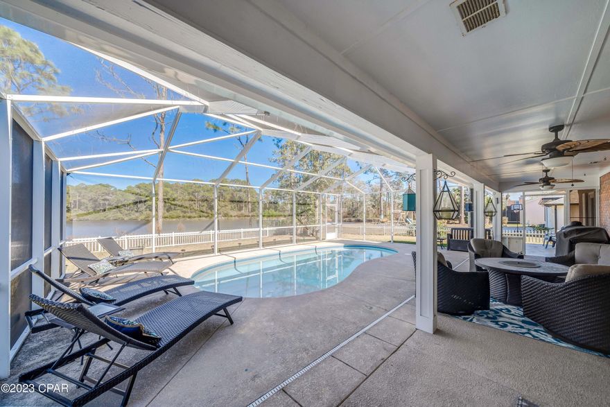 Open House Sat: 2/4 12-2! Walk in the door and you will be ready to make this your new home!  Gorgeous and recently remodeled kitchen, new vinyl plank floors throughout, updated master bath, coffered ceilings in the family room and more! New roof (2022) and a brand new HVAC (2022)!  This welcoming home has a great layout with large rooms, open concept and split bedroom plan.  Your floorplan flows out to your beautiful screened in pool area that overlooks the pond.  Additional heated and cooled square feet in garage that is currently being used as a workout room. Easy to walk, bike, and golf cart the neighborhood.  This home is centrally located in Panama City Beach, so convenient to Pier Park, Publix, gyms, restaurants, and the sugar white sand and crystal blue waters at the beach!