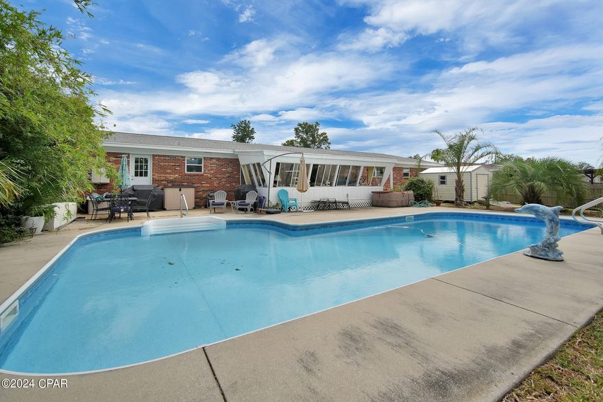 CURRENTLY UNDER CONTRACT, SELLER WILL CONSIDER BACKUP OFFERS. 
Lakefront 4 BR/2 Bath Home close to Tyndall Airforce Base with the most gorgeous oversized POOL overlooking Lannie Rowe Lake with a HUGE yard for all your needs. This charming home combines modern upgrades with a perfect location in Panama City, FL. Inside, the spacious layout is highlighted by stunning tile floors (2019) that flow throughout the main living areas, providing both style and durability. The completely remodeled kitchen (2019) offers sleek cabinetry, modern appliances, and ample counter space with breakfast bar-Perfect for home chefs and entertaining.  Step outside to a private oasis, where a new pool liner (2019) invites you to enjoy the Florida sunshine. The backyard is ideal for relaxation or hosting barbecues, with room for outdoor furniture and lounging. Rest easy knowing this home has had major updates, including a new roof (2018), hurricane straps (2023) for extra storm protection, new windows 2017, and a brand-new AC (2023) ensuring year-round comfort. Fun addition, the garage being heated and cooled, plus the new shed in the backyard for your extra storage. With all these upgrades in place, this home is not only stylish and move-in ready but also a smart investment for long-term peace of mind. Located close to schools, shopping, parks, and local beaches, this property is perfect for families, retirees, or anyone seeking a low-maintenance lifestyle with all the benefits of recent renovations.
