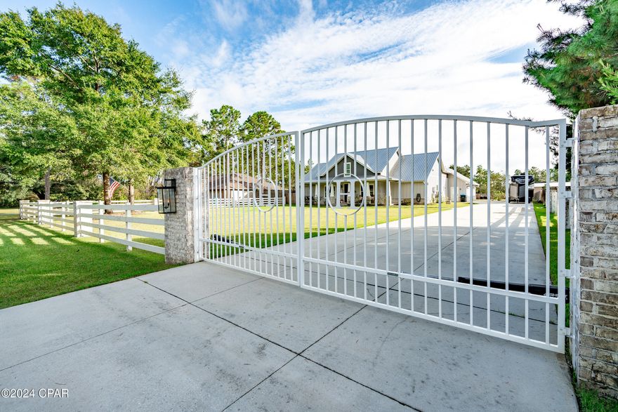 Incredible opportunity to own the best constructed, gated compound in Panama City.  This gorgeous home is built for family, friends and entertaining.  Sitting on a huge oversized lot, this custom home has 4 bedrooms and 3.5 baths.  Brick and board and baton hardy construction.  Amazing outdoor space with heated pool, full kitchen, gas grill, hibachi grill, ice maker and island.  Backyard with basketball, storage shed air conditioned and has spray foam insulation, currently being used as batting cages and weight room.  Storage shed can easily be transformed to garage.This home is in a great location 2 miles from from Bozeman.  Just outside of shops and stores in Lynn Haven and only 25 minutes from the most beautiful beaches in Florida.