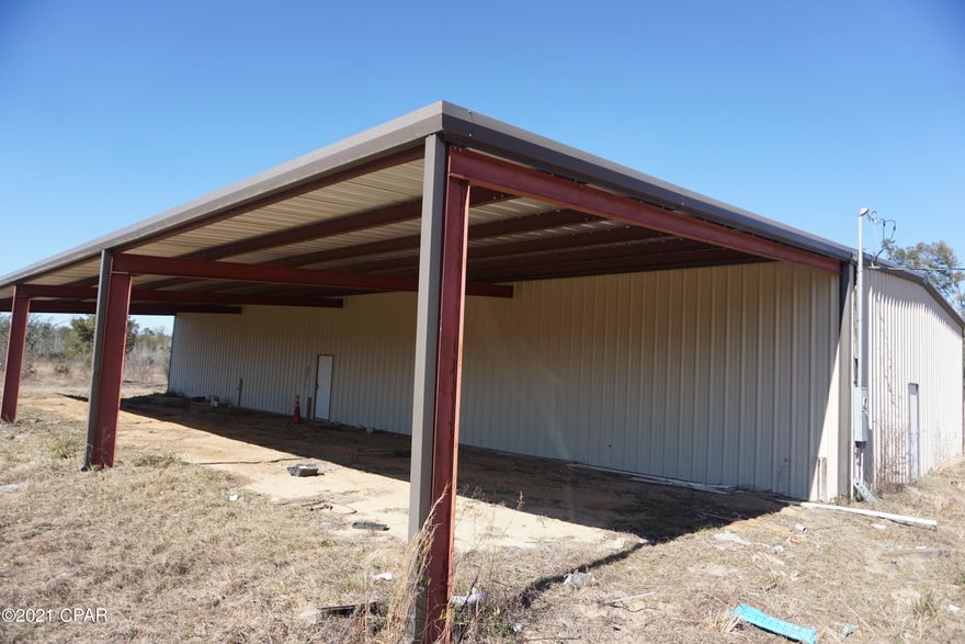 FOR LEASE -Large Metal Building located on 4.33 acres in a Rural Setting. This building would be a great building for warehouse or construction or mechanical. The structure was built in 2008 with 7,000 square feet of total building area, 4,000 sq ft of building constructed upon a concrete slab foundation with steel wall and roof framing. Metal insulated exterior wall and roofing panels with 2 ten foot tall metal manual roll up doors and 1 twelve ft metal roll up door. 10-12' ceiling height.
