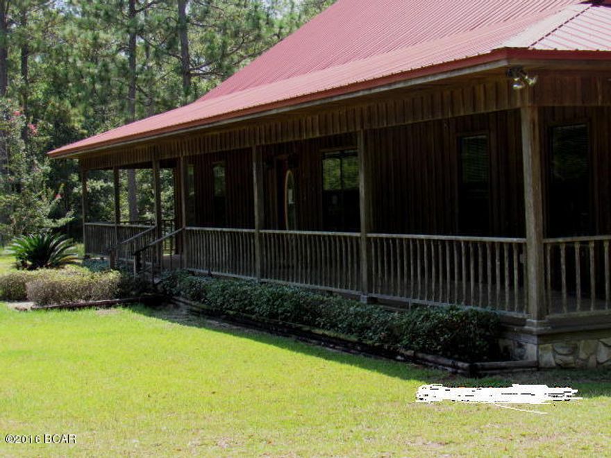 PRICE REDUCED!! Wonderful board & batten & stone home on 40 Acres in the country! Home is in excellent condition with beautiful pergo, tile and carpet floors. The living room has cathedral ceiling, the kichen is very modern with smooth surface range and dishwasher. There is a breakfast nook and a formal dining room. The home features split bedroom design with extra large master bedroom and bathroom. It has an extra large untility room. There is a porch that exends across the entire front of the house and there is a large enclosed screened back porch. You have a large barn/workshop and room galore on the 40 acres. There is approx. 10 aces of cleared land and rest is in woods. There is an abundance of wildlife in the area.