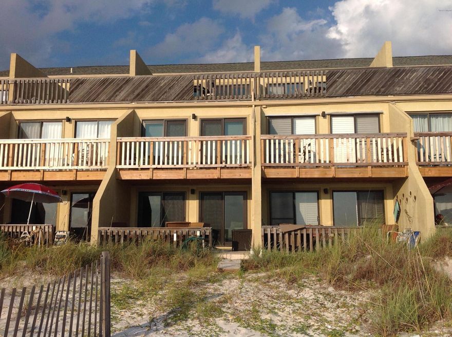 OPEN HOUSE 12/6/15 Gulf front Townhouse on the White Sandy Beaches.  This updated/renovated 3 level condo has all the extras and boast patio and balconies off of each level.  This 3 bedroom 3 bath townhouse has granite, updated tile, new interior and exterior doors, glass tile, floor to ceiling views of the Emerald Green Beaches. The kitchen has stainless appliances, a kitchen island, tons of cabinets, a pantry, double oven, and updated cabinets and lighting.  Two bedrooms have a gorgeous jack and jill bathroom, and one of the bedrooms is gulf front with its own large balcony.  And Finally the 3rd floor is the master suite with a fabulous bath fit for a king/queen.  This is a must see with all of the common amenities on the grounds AND a gated community.  A rare find and never been rented