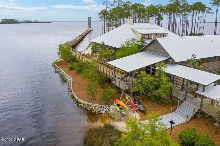 Amazing opportunity to build your new home in a gated waterfront community. Rivercamps is nestled between Crooked Creek and the intercoastal waterways, this community is designed to complement the natural beauty of the waterways, woodlands, and wildlife. Rivercamps offers many amenities including a resort pool, hot tub, gym, resort community center, boardwalks, nature trails, docks, a boat ramp and storage, kayaks, bikes, and much more and is just minutes from white sandy beaches. This Ella Mae spec plan features high end finishing's.  This home is built by a reputable builder that specializes in semi-custom constructions and each project is a one of a kind. You could be living in your new home by the end of the year with construction being complete in approximately 6 months.