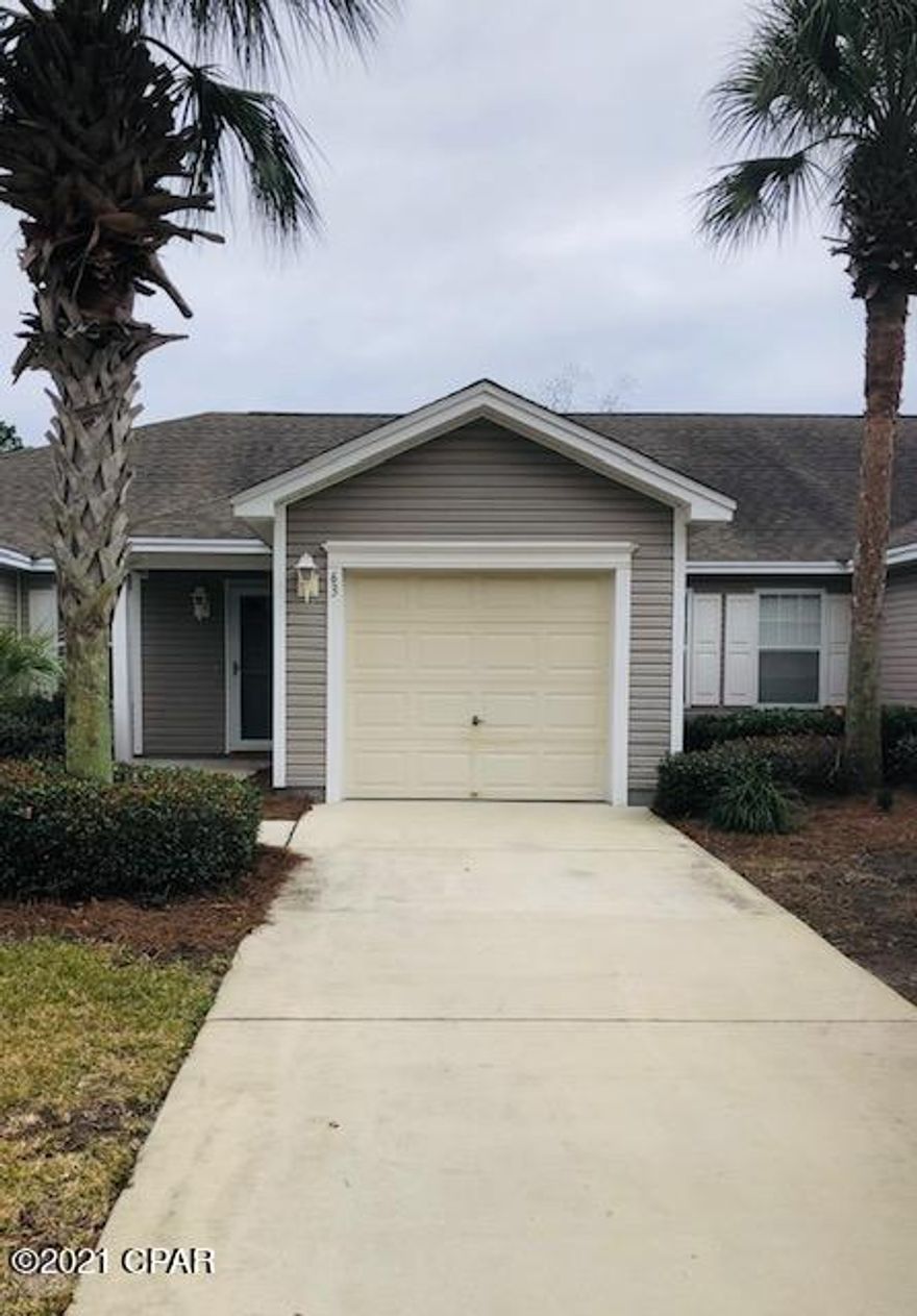 PRICE REDUCED! OPEN HOUSE THIS SUNDAY 2/14 1:00-4:00 Your chance to own a really beautiful home in one of the most sought after communities in Panama City Beach; Palmetto Trace. This two bedroom/two bathroom home features new flooring, new water heater & new interior paint. All appliances come with the home including washer & dryer! Immaculately kept, move-in ready home with a screened in patio overlooking the lake to enjoy your morning coffee or evening relaxation. Lawn care, twice a week, irrigation, trash pick up, two community pools & building pressure washing are all included in the low HOA fees. Buyer is responsible for a .5% fee. Room sizes approximate.