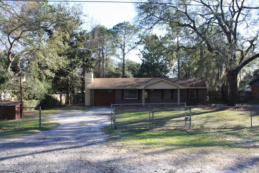 This home is move in ready with 3 bedrooms, 1 bath, laundry room, kitchen and dining area, Living room with a step down den with a lovely fireplace.

It has a nice front porch to sit out on and also has a screened in back porch with a nice sized back and front fenced in yard.

This is in a very sought after location quiet and on a paved road.

It is on a private well for irrigation and city water is available to hook up to with septic system, so that will save on monthly fees. Has beautiful shade trees.