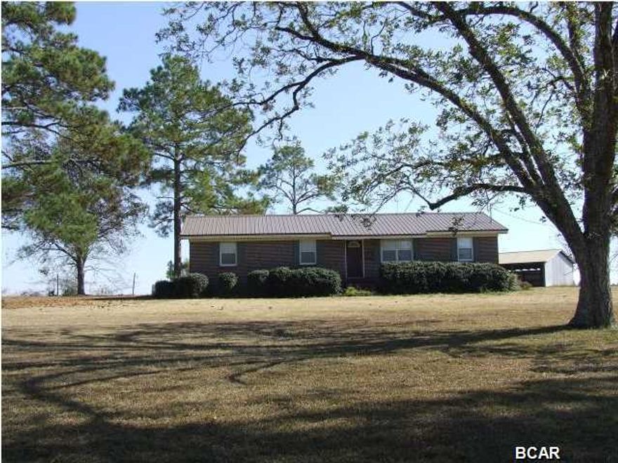 BEAUTIFUL SETTING! Nice and quiet country home, priced to SELL!!! This 3/2 on 1.5 acres is located on a hilltop corner parcel in the Poplar Springs Community, only 3 miles to Poplar Springs School! This home features hardwood floors in living room and guest bedroom, sitting area in guest bedroom, a 36x24 barn and workshop with electricity and water, a new metal roof, a covered deck, and a screened in porch. The inside of this home is a MUST-SEE! Plenty of privacy and great views of open land all around. Country living at it's best! Make an appointment to see this one today!