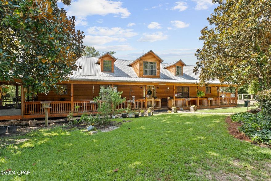 Discover serenity and seclusion on this beautiful 3.69-acre property featuring a charming cabin surrounded by nature. This unique retreat boasts two picturesque ponds, one of which is spring-fed, providing a tranquil setting. Upon entering the cabin, you're greeted by a large entryway leading to a spacious loft. The kitchen is perfectly sized and includes a large walk in pantry. The cabin offers generous bedrooms, ideal for expanding families or peaceful getaways.

Perfect for a campground or family retreat, the property includes several storage buildings and a large 48x36 barn with ample storage and an air-conditioned work area, located behind the pond. There is also a raised flower bed, adding to the property's charm. The 36x24 boat barn, which can hold three boats, is equipped with electricity, providing convenient access and utility for water activities. A four-dog kennel is great for hunting enthusiasts, and the large cook shed is perfect for outdoor cooking.

Nestled amidst the scenic pond area, this retreat is ideal for family reunions and events. Less than an hour from Ft. Novosel and an hour and a half from Panama City Beach, FL, the property is also near several lakes, creeks, the Choctawhatchee River, and springs, making it perfect for nature lovers and outdoor enthusiasts. Don't miss out! Schedule a showing today to experience this exceptional property for yourself. Contact your realtor for more details.