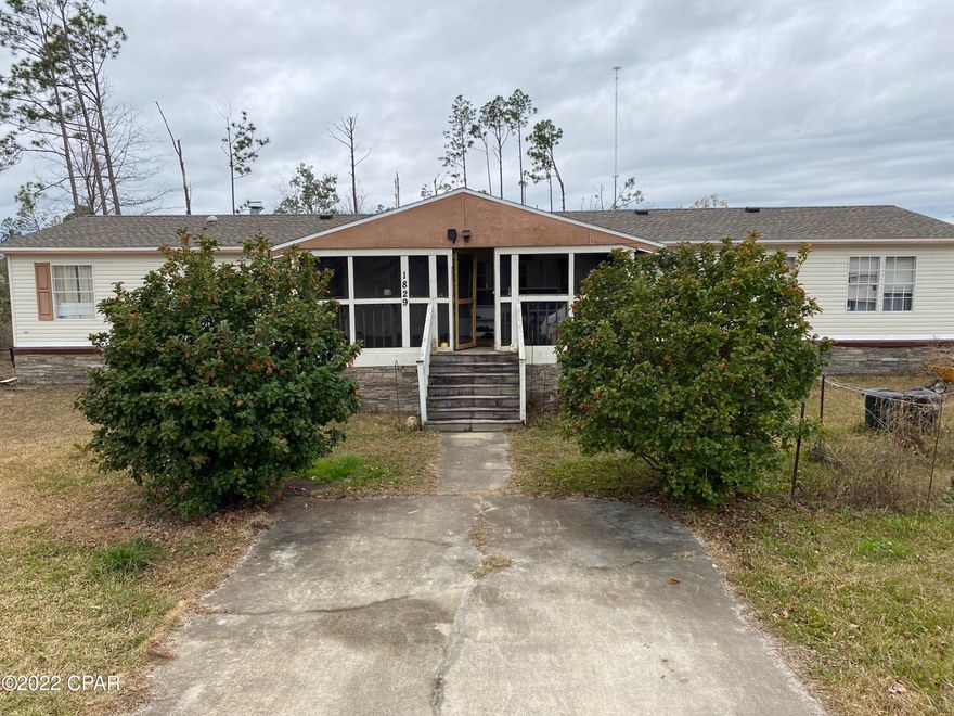 Great atmosphere if you love country style living! This property has so many creative capabilities. Plenty of outdoor, indoor space. Approximately 2,160 sq. ft. of living space situated on .942 acre of land! New roof post hurricane. Recent new flooring installed. Great Location. Approximately 20-minute drive to Tyndall Air Force Base. This property has a private well and a septic tank.