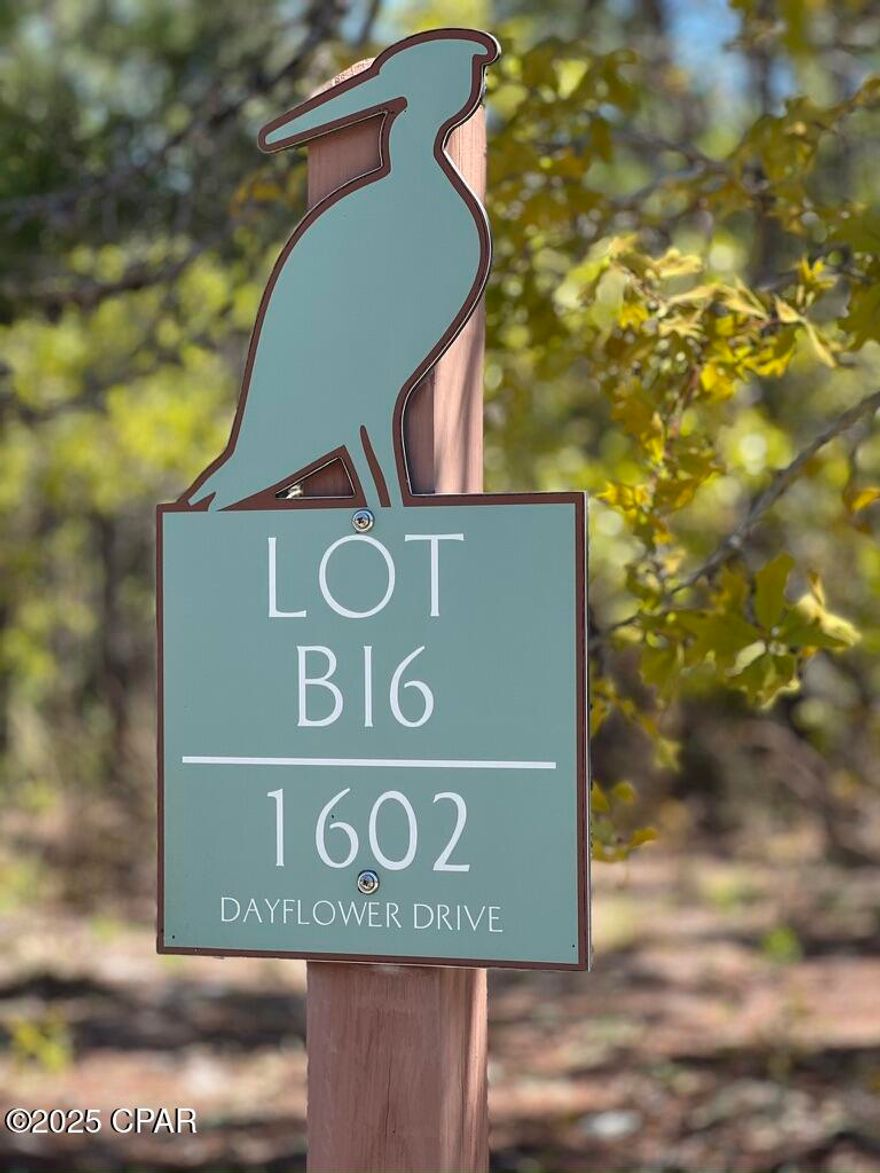 Beautiful wooded lot in desirable Wild Heron.  Golf course winds throughout area and behind this lot.  Plan and build your dream home.