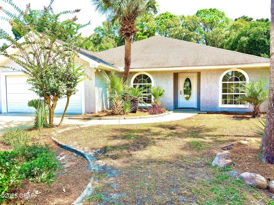Beautifully maintained 4-bedroom, 3-bath home in Grand Lagoon Shores, just minutes from the beach. One bedroom features a private en-suite bathroom; another guest bedroom has direct access to the covered back patio. Open floor plan with family room, dining area. Kitchen includes double oven and ample cabinetry. High ceilings, crown molding, and built-ins throughout. Covered back patio overlooks fully fenced yard with pool, hot tub, and fire pit. Pool equipment conveys with the home. Located in a highly desirable Panama City Beach neighborhood.