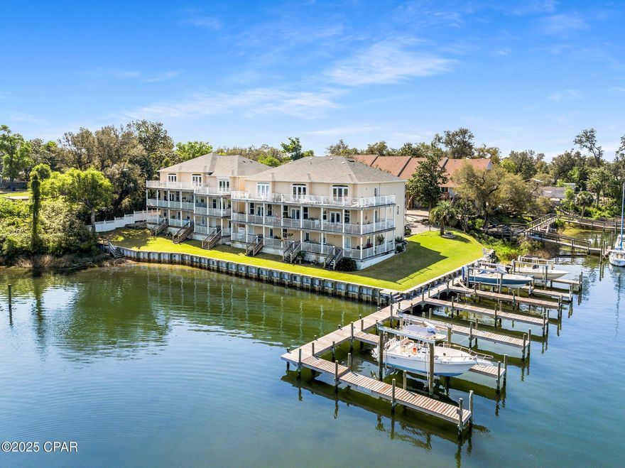 Waterfront Living in the Heart of Panama City

Welcome to 246 E 3rd Place, where waterfront living meets timeless elegance. Perfectly positioned in the historic Cove neighborhood and just minutes from vibrant downtown Panama City, this stunning 3-story townhome offers the ultimate blend of comfort, convenience, and coastal charm.

With 3 spacious bedrooms, 3.5 bathrooms, and a 2-car garage, this home boasts breathtaking views of Massalina Bayou and direct Gulf access via your deeded deep-water boat slip—14x40 feet, wide and deep enough to accommodate both sailboats and larger dream vessels.

Step inside to find a thoughtfully designed layout that maximizes both space and privacy. A power chair lift provides easy access to the main level. The first floor features a generous bedroom with a full bath and access to a large private deck overlooking the water—perfect for guests or a serene office space.

The second floor is the heart of the home, where soaring 9-foot ceilings, Brazilian hardwood floors, and abundant natural light create a warm and welcoming atmosphere. The open-concept living and dining areas flow into a well-appointed kitchen featuring emerald black granite countertops, custom cabinetry, and an oversized pantry.

On the third floor, the luxurious primary suite offers a peaceful retreat with its own private balcony and panoramic views of the harbor. There's even space for a home office or workout area. The ensuite bathroom features double vanities, a jetted soaking tub, a walk-in shower, and a spacious walk-in closet. An additional bedroom on this level comes with its own full bathroom and could easily serve as a second primary suite.

Built with quality in mind, this home includes a 6-year-old roof, brand-new water heater, fresh interior paint, hurricane shutters, a fire sprinkler system, and 2x6 exterior framing. It's also prepped for an elevator, making it future-ready.

Whether you're an avid boater, seeking a low-maintenance waterfront escape, or looking to enjoy the lifestyle and charm of downtown living—this home has it all.

Don't miss your chance to live where every day feels like a vacation. Schedule your private tour today.