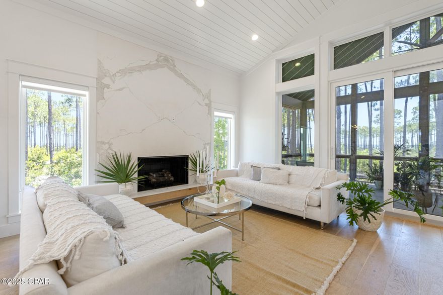 Nestled in the sought-after RiverCamps on Crooked Creek community, this meticulously crafted Romair construction sits on a 1.1-acre lot with stunning views of West Bay. RiverCamps has a boat launch with direct water access to Crooked Creek, West Bay, and ultimately the Gulf of Mexico-offering unmatched access to some of the area's most scenic waterways. Boat to Uncle Ernie's Restaurant and Shell Island in 15 minutes! Enjoy kayaking, paddleboarding, fishing, or simply enjoy water views from your living room. This gated, luxury community also has a wildlife sanctuary that sprawls 1,500 acres. Residents can enjoy miles of trails that wind through the community, bird watching, camping, and pickle ball. A brand new community pool is set for completion in May. Nestled in the sought-after RiverCamps on Crooked Creek community, this meticulously crafted Romair construction sits on a 1.1-acre lot with stunning views of West Bay. RiverCamps has a boat launch with direct water access to Crooked Creek, West Bay, and ultimately the Gulf of Mexico-offering unmatched access to some of the area's most scenic waterways. Boat to Uncle Ernie's Restaurant and Shell Island in 15 minutes! Enjoy kayaking, paddleboarding, fishing, or simply enjoy water views from your living room. This gated, luxury community also has a wildlife sanctuary that sprawls 1,500 acres. Residents can enjoy miles of trails that wind through the community, bird watching, camping, and pickle ball. A brand new community pool is set for completion in May. 
The spacious primary suite has a walk-in closet and an en suite with freestanding tub, walk-in shower, and double vanity with quartz countertops. Enjoy your mornings on the covered balcony with bay views. Two generously-sized guest bedrooms are located on the other end of the home for privacy and both have en suites with walk-in showers and pedestal sinks. There is a large, dedicated laundry room with sink, tile backsplash, quartz countertops, and built-in cabinetry for storage.
RiverCamps is conveniently located less than 7 miles from Northwest Florida Beaches International Airport, less than 10 miles from Panama City Beach, and a 25-minute drive from Rosemary Beach and 30A. Schedule a showing today! Buyer to verify all pertinent information in listing. Seller will include Engineered plans for bottom floor enclosure, providing the opportunity for future expansion and customization.