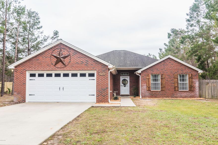 Beautiful home on an acre! From the moment you walk into this home, you will notice the open floor plan with huge living room/dinning room combo. The beautiful tile floor and custom wood burning fireplace is sure to impress. You'll love the open kitchen with plenty of cabinet space and stainless steel appliances. All three rooms are good size and offer ample closet space. Master bedroom has french doors leading to covered patio and a nice size bathroom with double sink vanity's. The back yard is fully fenced and ready to store your toys. Many rooms have recently been painted. Pride of ownership shows through in every inch of this home!