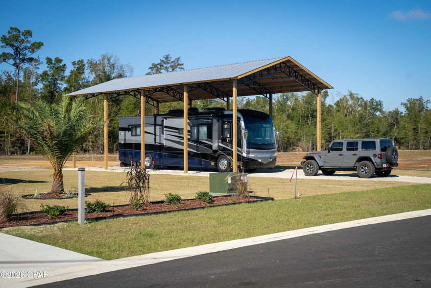 Our Town RV Estates is an upscale RV friendly community located in Wewahitchka, FL just off Hwy 71 in the sportsman's paradise of Gulf County. Here you'll find a rural lifestyle at its best with Fishing, hunting and boating minutes away. To top it off the white sandy beaches of the Forgotten Coast, including Mexico Beach, Cape San Blas and Port St. Joe are all just a short 25-minute drive. Come enjoy this one-of-a-kind community featuring average 1/3 acre lots with concrete driveway apron, water, metered electric with 50-amp and 30-amp RV hookups, septic is featured on this lot but others will need to add that on, paved road, storm water management system, underground utilities and personal locking mailboxes. Come vacation or live here full time without the hassle of searching for a place to stay, having to buy a lot, get permits, hire contractors and deal with infrastructure issues just to get the property usable. There is an HOA to ensure each owner's investment is protected and the community will be maintained to the highest of standards. Upgrades can be done by the owners or buyers at any time. Check out our Web Page OurTownRvEstates.com for pricing and more information.