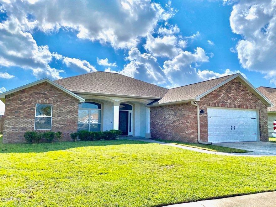 All Brick home with a decorative stucco entrance. The neighborhood offers sidewalks and underground utilities.This home offers an open floor plan, with the living, dining and kitchen all accessible. Tile flooring throughout the home, except new laminate flooring in the bedrooms, gas fireplace, crown molding is in the entry, living and dining area, chair railing in the dining,10 ft ceilings, solid surface & granite counter tops, custom cabinets, separate tile shower and tub in the master. The 2nd and 3rd bedrooms have their own linen closets in the hallway. New Paint on all exterior and interior. Fenced back yard, that offers a screened in patio and an open deck. All interior lighting is LED. Close to Tyndall Air Force Base, shopping and Restaurants. This is a must see home.