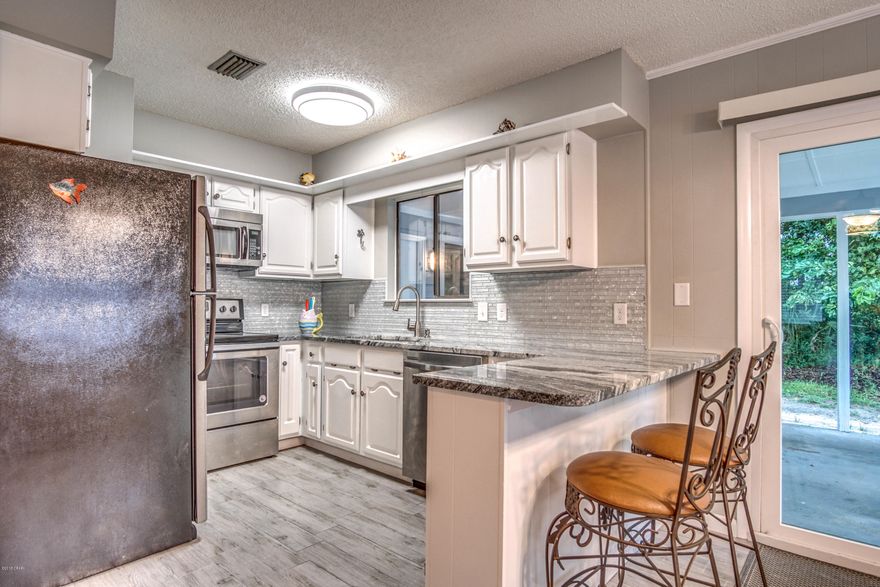 Only a block off the Gulf, this cute 4 bedroom, 2 1/2 bath home is move in ready. The kitchen and bathrooms were just remodeled, and there is fresh paint on the interior and exterior of the home. The vacant lot next door is included in the sale of the property, but you can purchase the home without the lot if you like. It would be a great space for a resort style pool. The back deck has gulf views, and the front porch is perfect for relaxing and enjoying the peace and quiet of the area. If you have been looking for your beach house, or investment property, look no further.